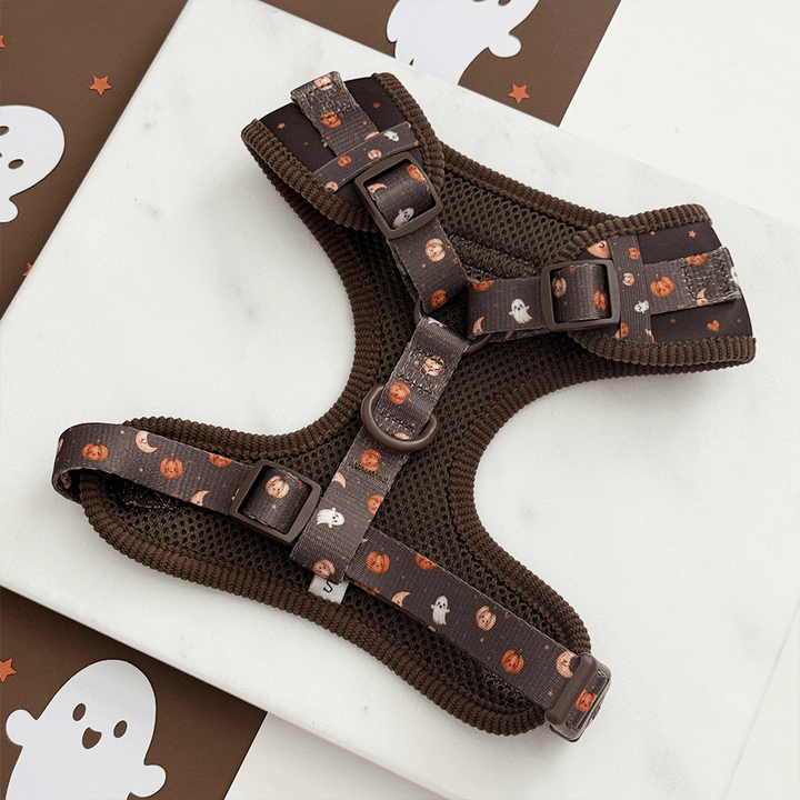 Brown dog harness with cute Halloween print featuring pumpkins, ghosts, and moons.