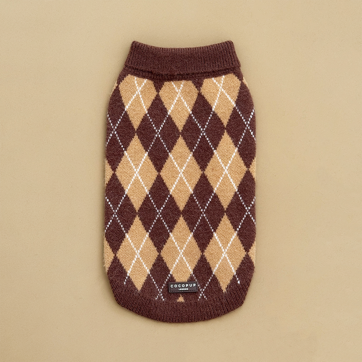 Dog jumper in a brown, tan, and white argyle pattern. 