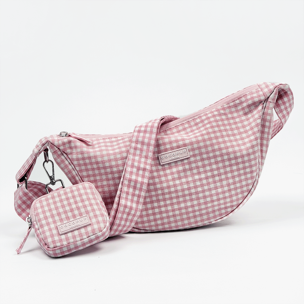 Pink and white gingham check design bag with matching strap and treat pouch for dog treats.
