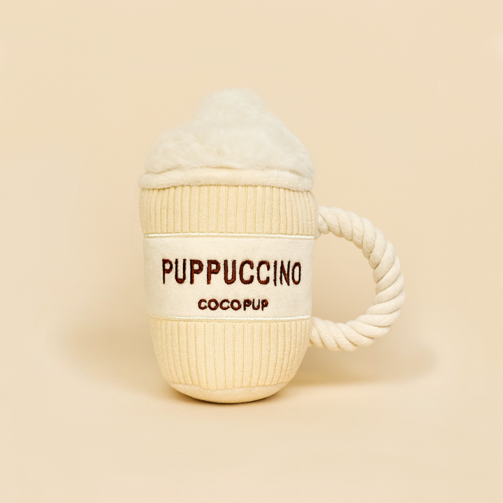 Dog toy designed like a cup with 'PUPPUCCINO COCOPUP' text on a beige background