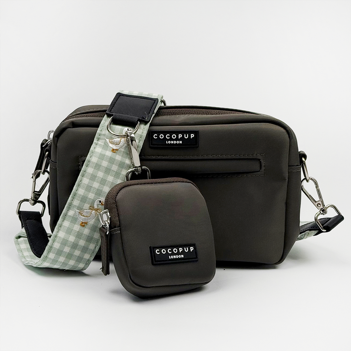 Cocopup mocha coloured dog walking bag, with green and white check print bag strap attached.