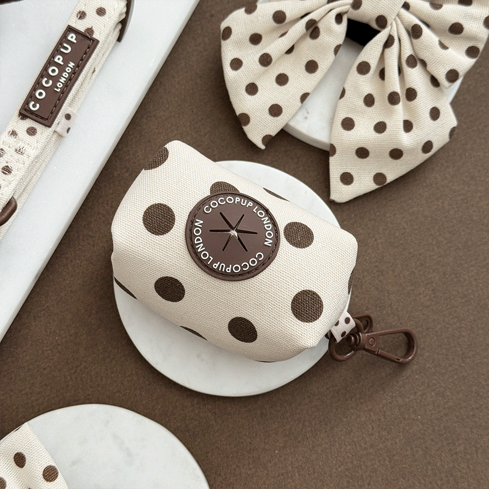 Polka dot product with COCOPUP London branding on a brown surface