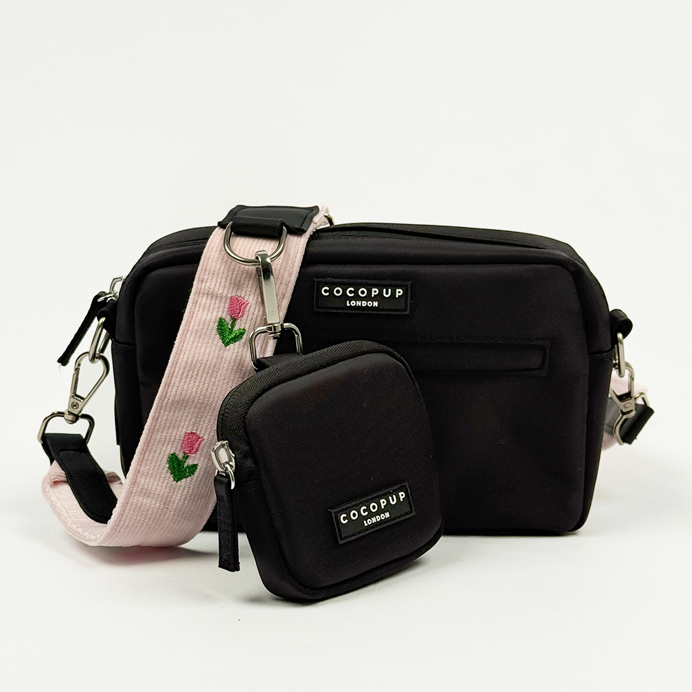 Black Cocopup Dog Walking Bag with Treat Pouch attached and pink bag strap with tulip embroidery design.