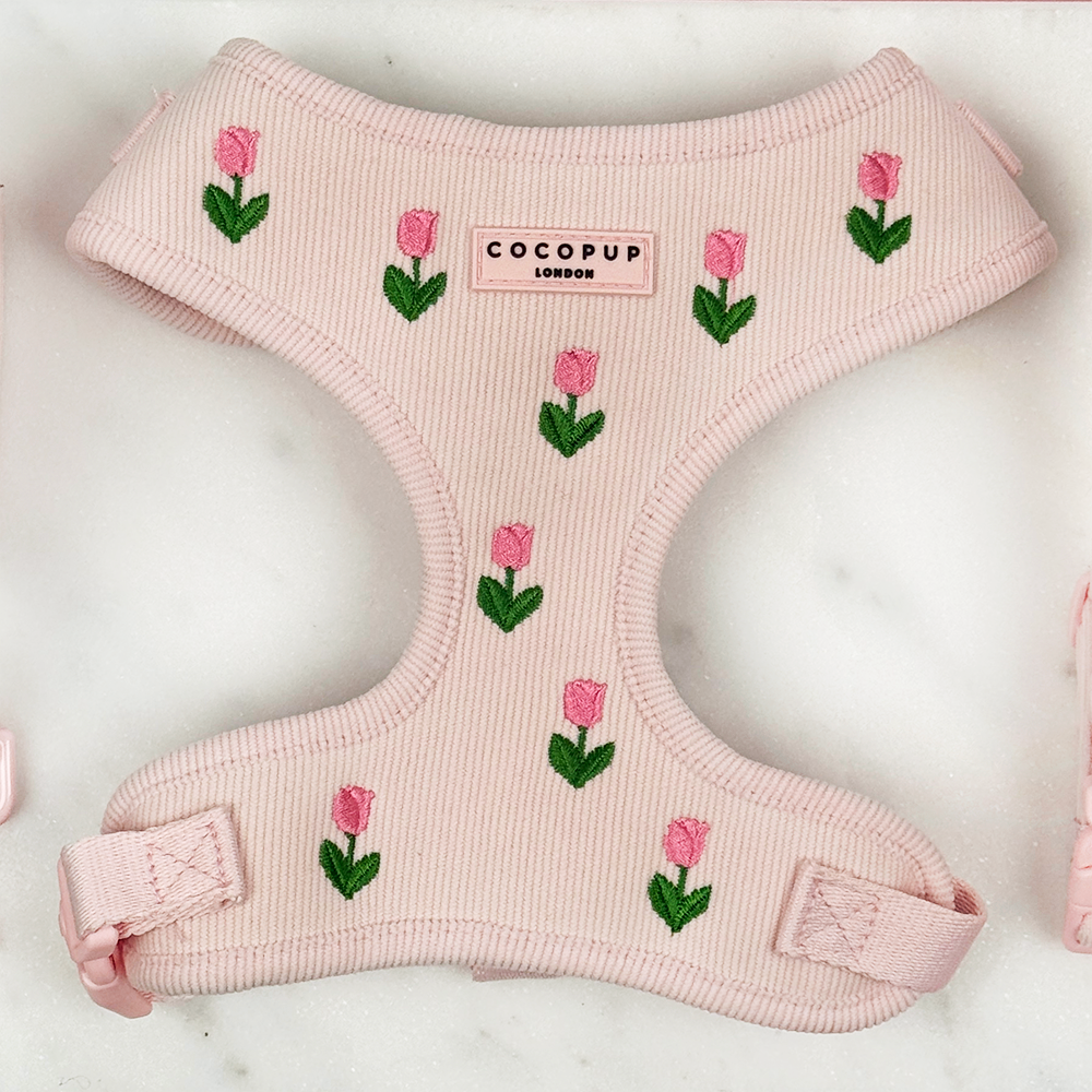 Pink dog harness with tulip embroidery design, with Cocopup logo.